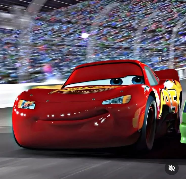 the cars from disney pixar are racing in front of an audience