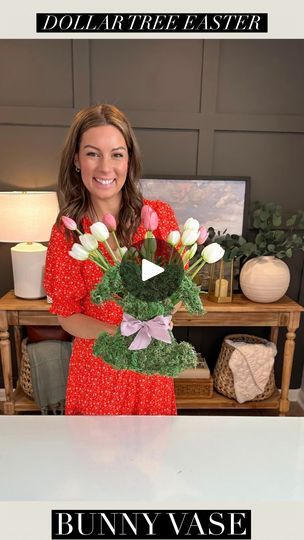 a woman holding a bouquet of flowers in her hands