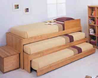 a child's bedroom with bunk beds and bookshelves