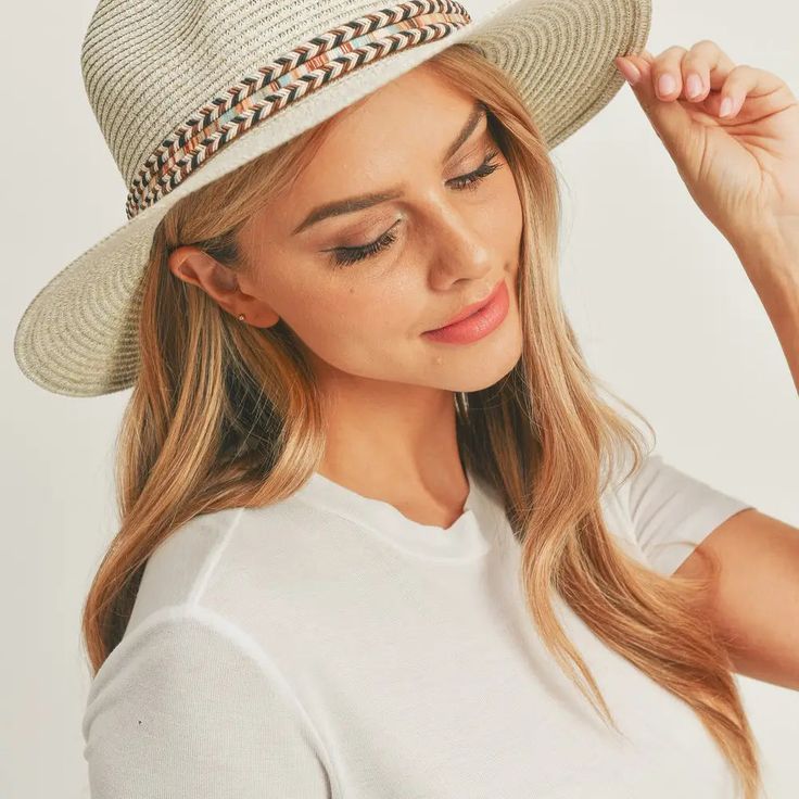 Add a touch of boho charm to your look with this stylish Straw Panama Fedora Hat! Quality crafted and accented with a Boho embroidered band, this hat is the perfect way to stay looking cool and on-trend. Plus, the suede tie accent gives it a unique touch! Material: 100% paper straw Circumference: 22" Brim length: 3.25" Chic Braided Hat With Flat Brim, Bohemian Panama Hat For Spring Festival, Bohemian Lightweight Brimmed Hat, Bohemian Brimmed Lightweight Hat, Chic Wide Brim Braided Hat, Braided Flat Brim Fedora, Bohemian Adjustable Straw Hat For Spring, Bohemian Woven Sun Hat For Spring, Festival Wide Brim Panama Hat