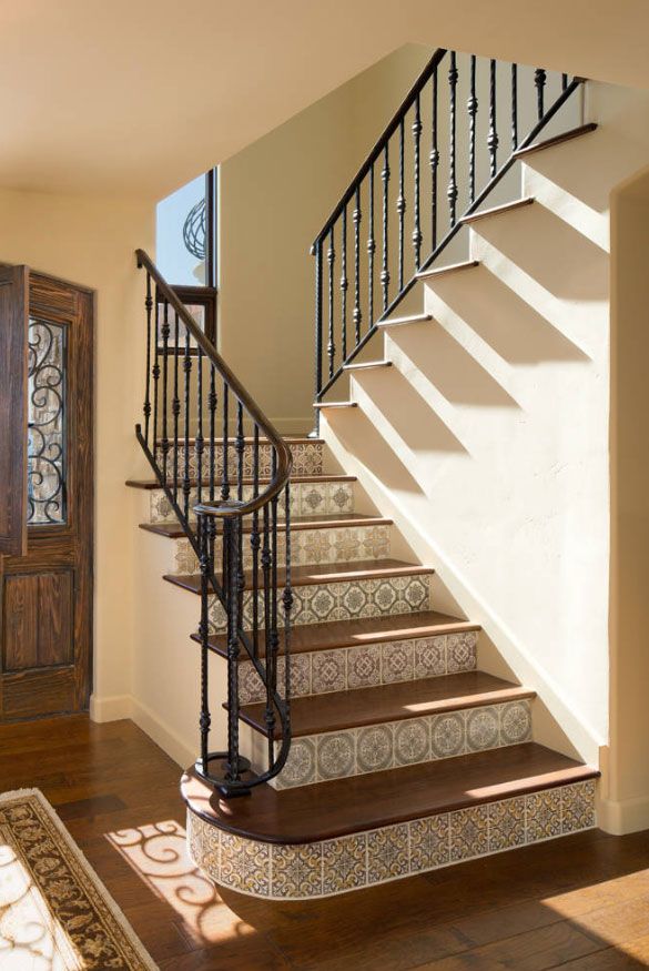 a stair case next to a wooden door