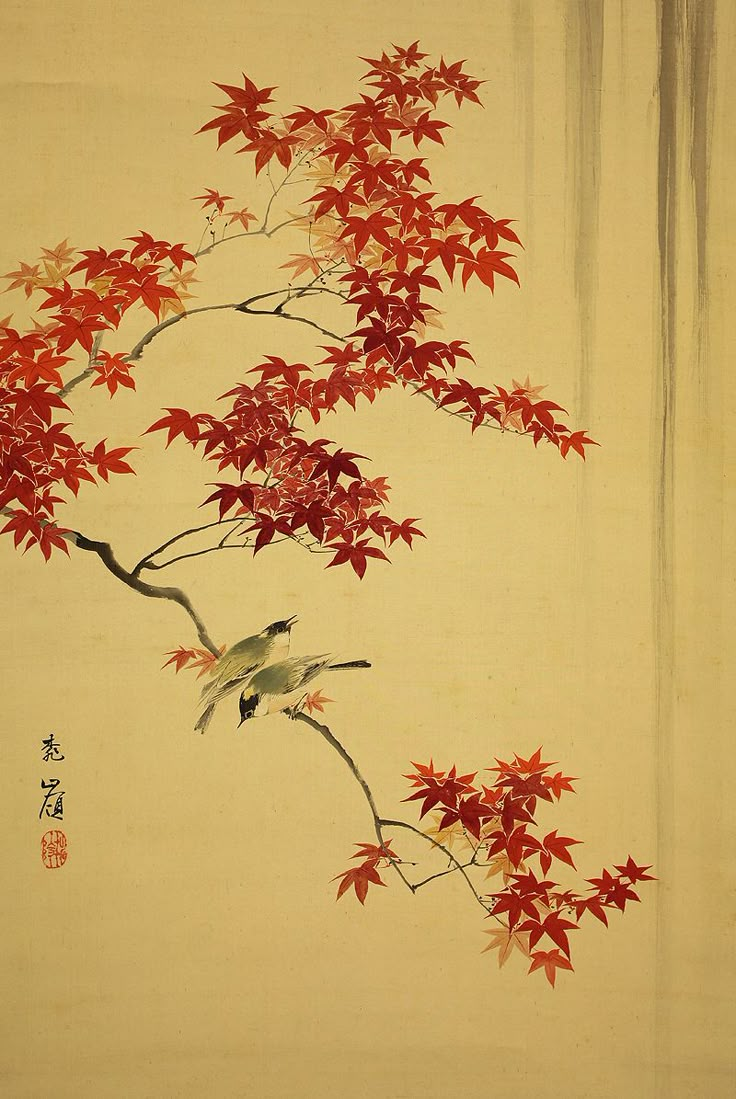 two birds perched on a branch with red leaves