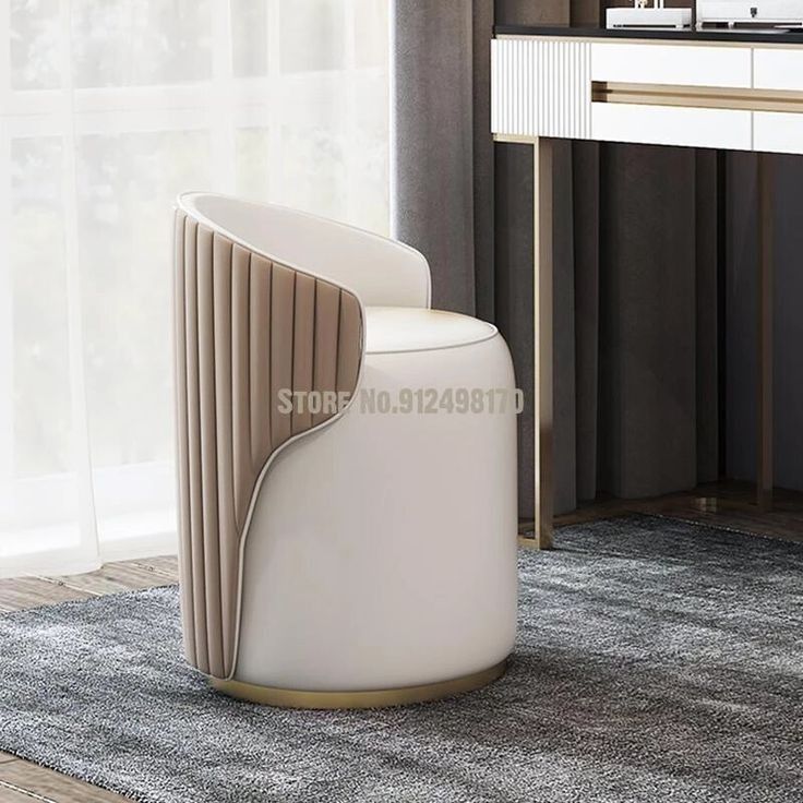 a white chair sitting on top of a rug next to a desk