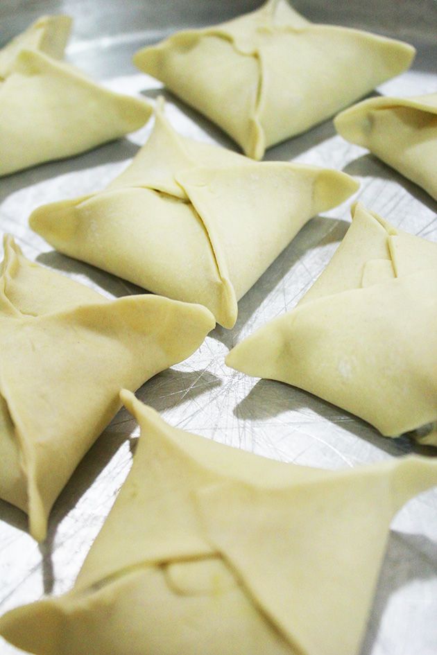 some dumplings sitting on top of a metal pan