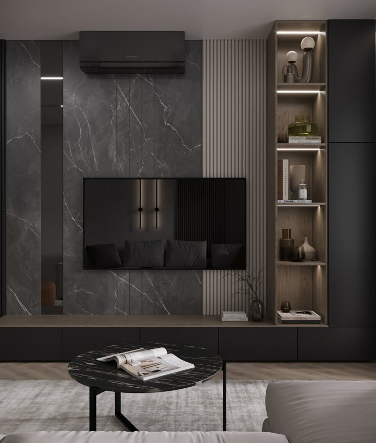 a modern living room with black and white walls, built - in shelving units and a marble coffee table