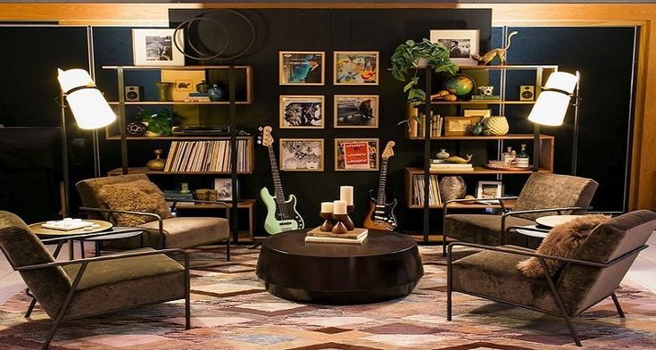 a living room filled with furniture and lots of books on the shelves next to each other