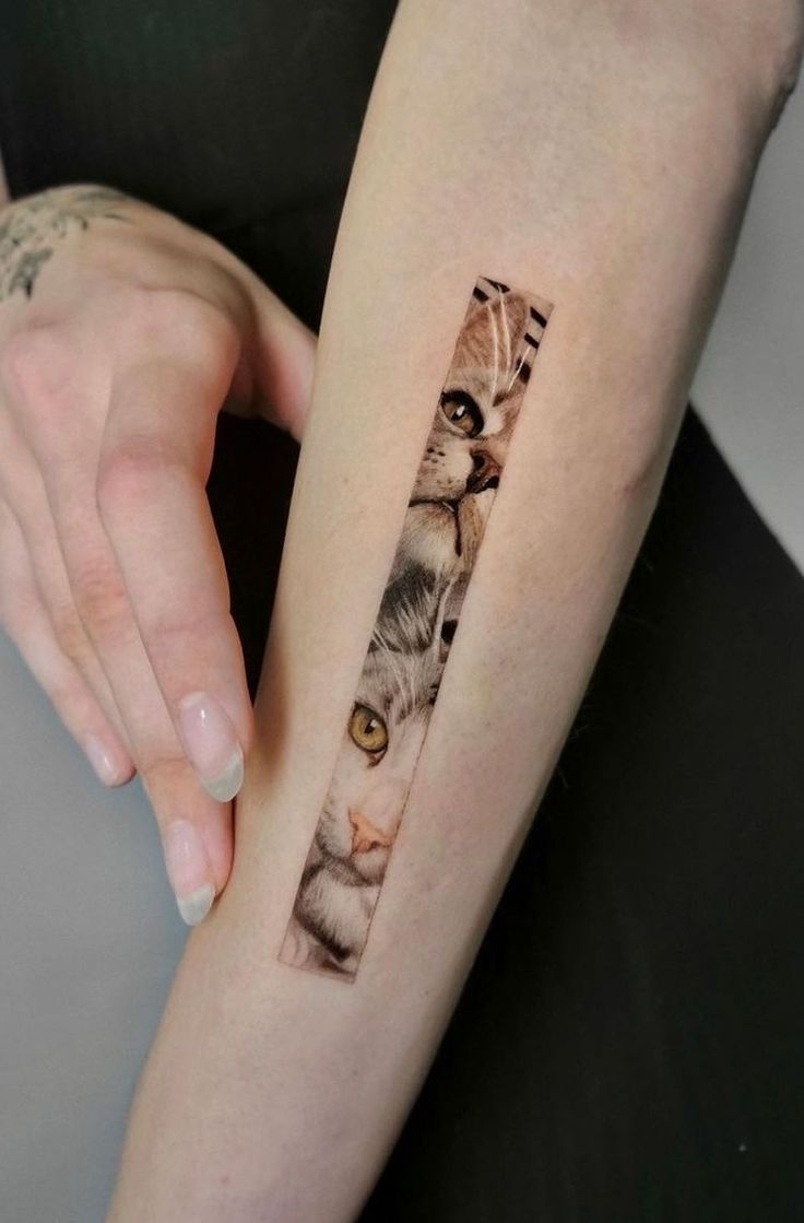 a woman with a cat tattoo on her arm