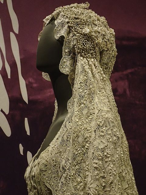 a dress on display in front of a purple background