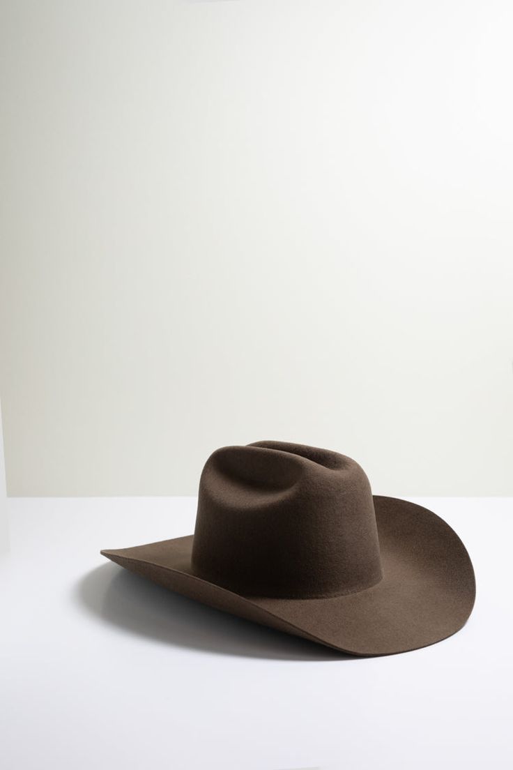 Classic. Cool. Totally on-trend. This brown, curled brim wool cowboy hat stands the test of time. Dress it up or down with the right mix of accessories from bands to feathers and pins. Details: 100-percent Australian wool Crown 4" Brim 4" Hidden adjustable band for fit flexibility See sizing chart Return policy Brown High Crown Hat Band For Country Events, Brown High Crown Hat Bands For Country Events, Western Hats For Country Events In Winter, Brown High Crown Hat For Western-themed Events, Western Felt Hat For Rodeo In Winter, Brown High Crown Top Hat For Rodeo, Classic Brown Top Hat For Country Events, Curved Brim Fur Felt Hat Bands For Rodeo, Western Style Felt Hat For Rodeo In Winter