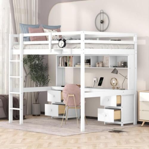 a white loft bed with desk underneath it