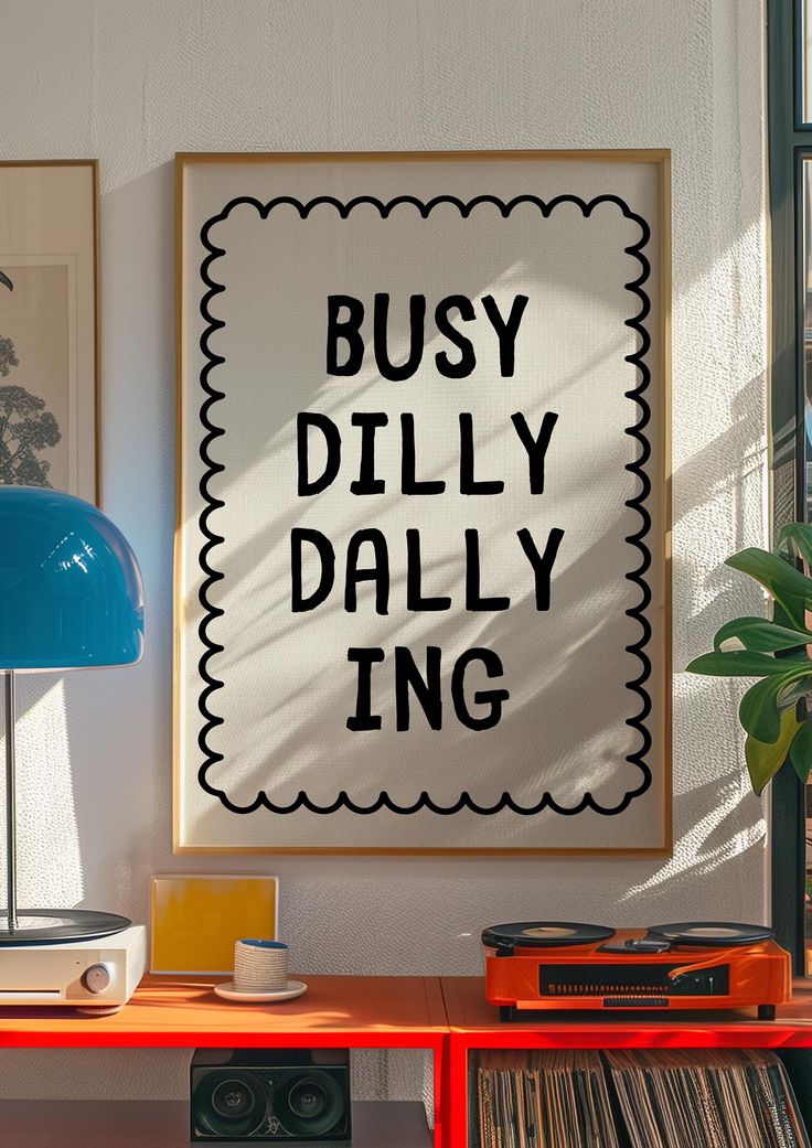 a poster that says busy dillly ing on the wall next to a record player