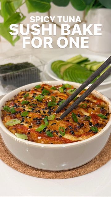 sushi bake for one with chopsticks in the bowl and green leaves