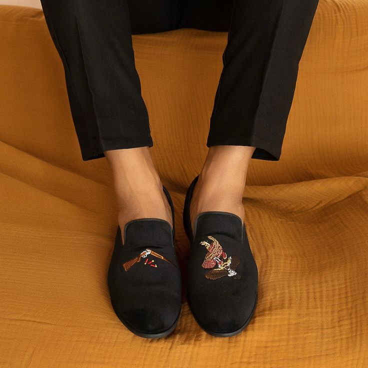 The Quail Hunt Slippers from May Anthony epitomize luxury and indulgence. Crafted individually by hand, these loafers feature premium velvet material and rayon embroidery thread, capturing the essence of savoring life's finer moments. Perfect Gift for the Christmas and Holiday Season Leather Lined Insole for extra support & comfort Stacked 0.75 inch heel Runs True to Size Formal Embroidered Round Toe Loafers, Black Embroidered Slip-on Loafers, Black Traditional Formal Loafers, Traditional Black Formal Loafers, Quail Hunting, How To Make Shoes, Velvet Material, Embroidery Thread, The Christmas