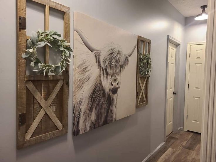 three paintings hang on the wall next to each other in front of a door way