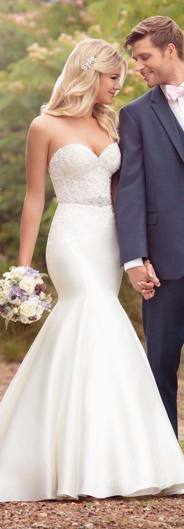 the bride and groom are holding hands