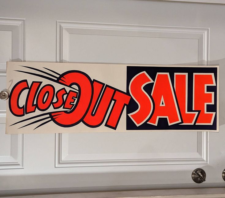 a close up of a sign on a door with the word sale written in red