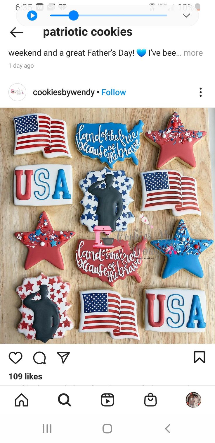 cookies decorated with the american flag and stars are displayed on a wooden table in front of an instagram page