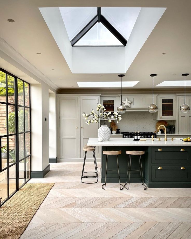 an open kitchen with skylights above the island