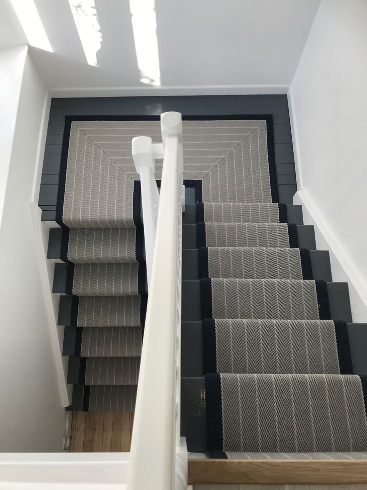 an overhead view of some stairs with carpet