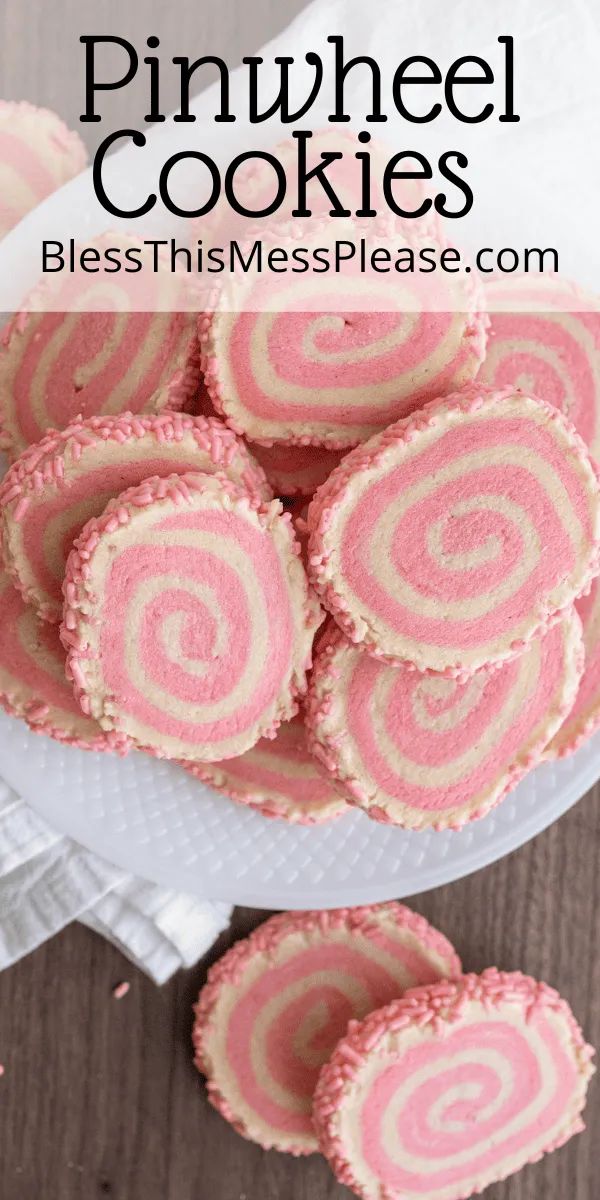 pink and white striped cookies on a plate