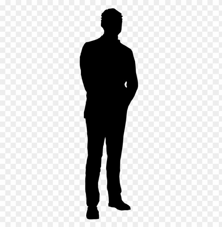 the silhouette of a man standing with his hands in his pockets, wearing a suit and tie