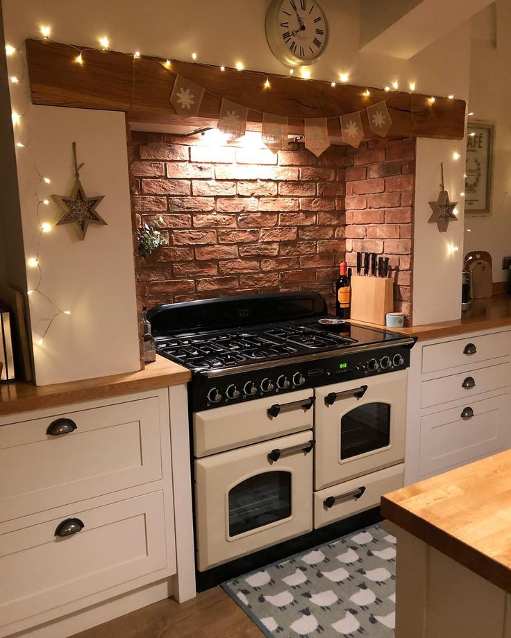 a kitchen with an oven, counter and shelves