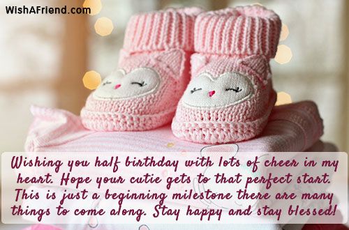 a pair of pink baby booties sitting on top of a pile of blankets with the caption wishing you half birthday with lots of cheer in my heart hope