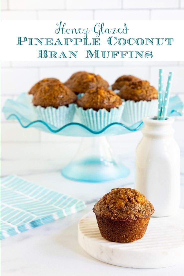 muffins sitting on a plate next to a bottle of milk