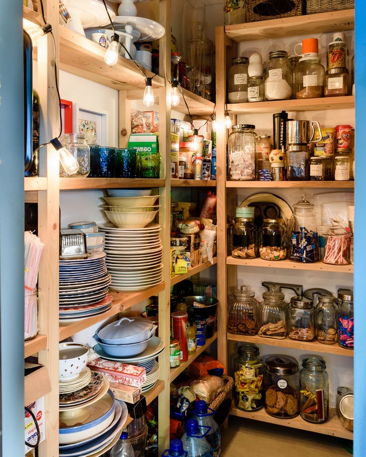 a pantry filled with lots of plates and bowls