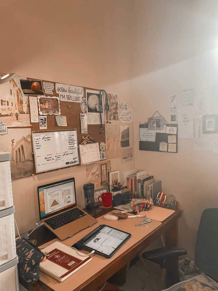 a desk with a laptop computer on top of it