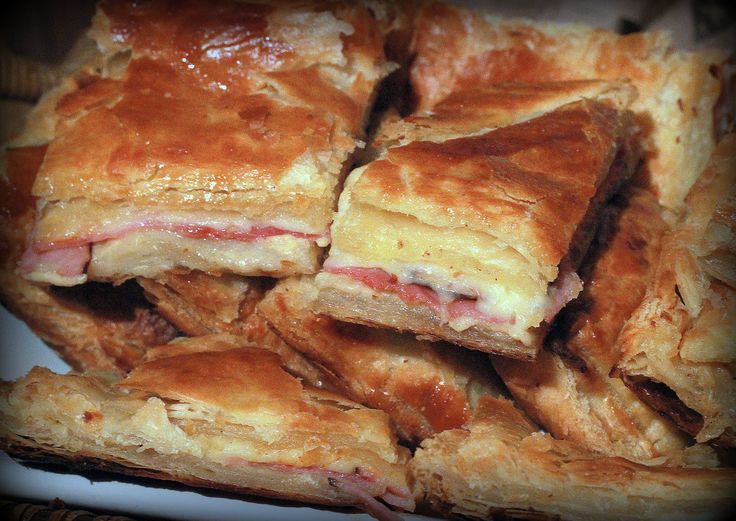 a pile of pastries sitting on top of a white plate