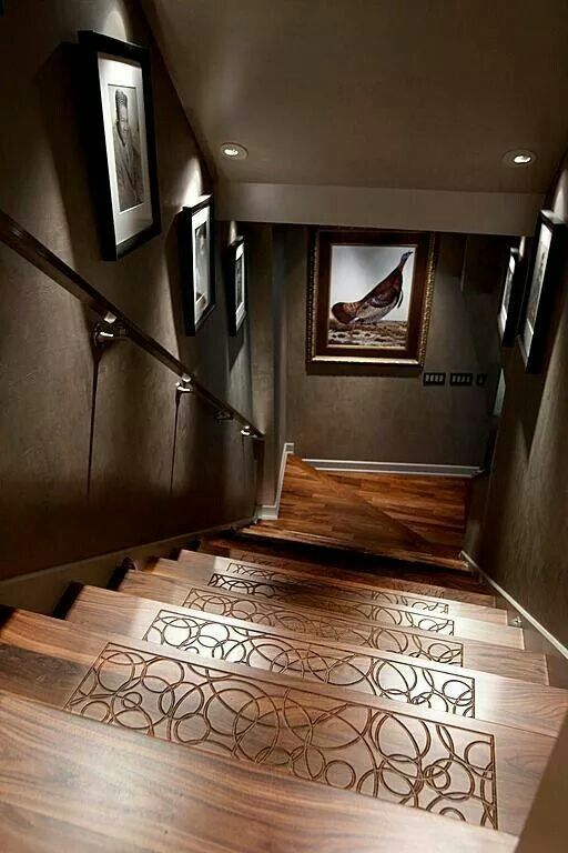 the stairs are made of wood and have decorative designs on them