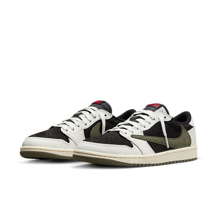 The Air Jordan 1 Retro Low OG SP 'Travis Scott Medium Olive' is a stylish sneaker that features a unique blend of Sail and Black colors. It is inspired by Travis Scott's signature details, such as the oversized backward Swoosh on the lateral side, tongue, inner panel and insole with the Cactus Jack branding. The sneaker is finished with the iconic Air Jordan Wings on the right heel and Scott's rough-drawn face on the left heel. It is perfect for any street style look and is made with a rubber so Travis Scott Olive, Jordan Travis Scott, Travis Scott Shoes, Mid Jordan 1, Travis Scott Jordan 1, Womens Air Jordans, Exclusive Sneakers, High Sneakers, Womens Jordans