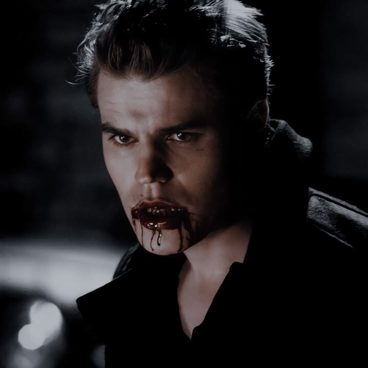 a man with blood dripping from his mouth