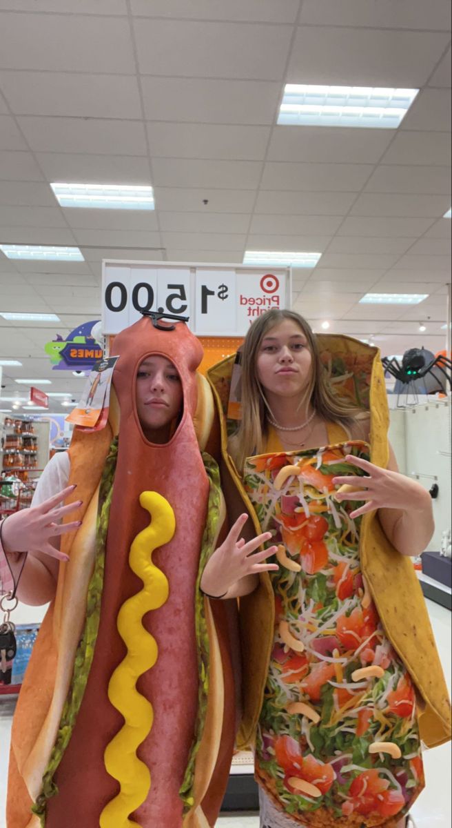 two people dressed up as hot dogs for halloween