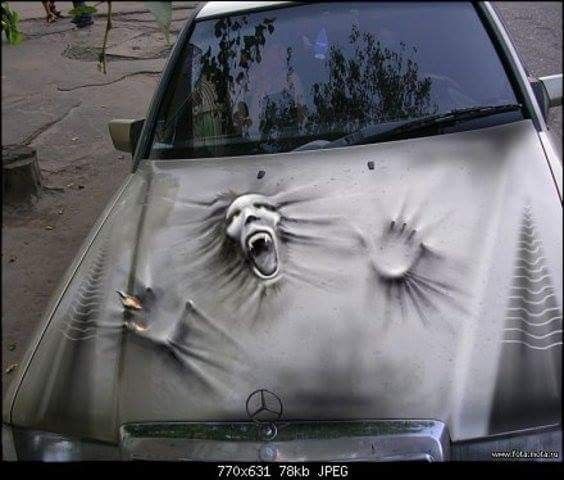 a car with an animal's head painted on the hood