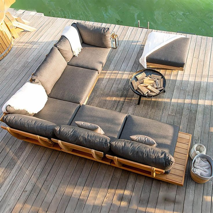 a couch sitting on top of a wooden deck