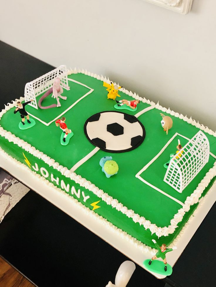 a soccer themed birthday cake on a table