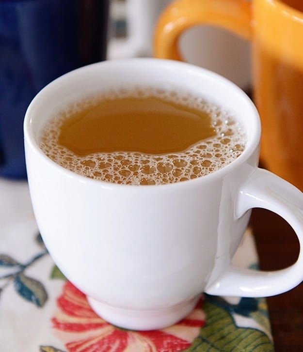 there are three cups of coffee on the table next to each other and one is filled with liquid