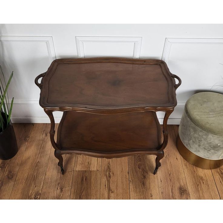 two wooden trays sitting next to each other on top of a hard wood floor