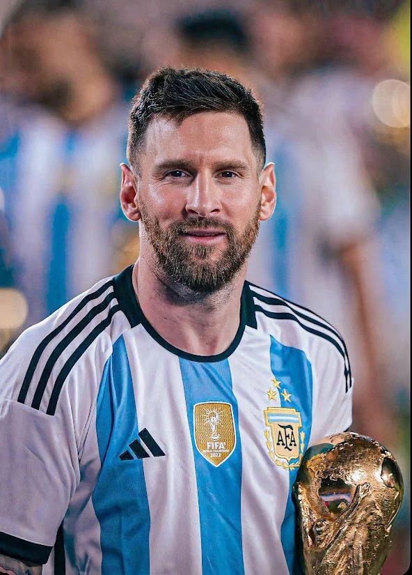 a man with a beard holding a soccer ball