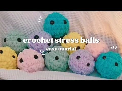 there are crochet balls in the middle of a bed with words above them