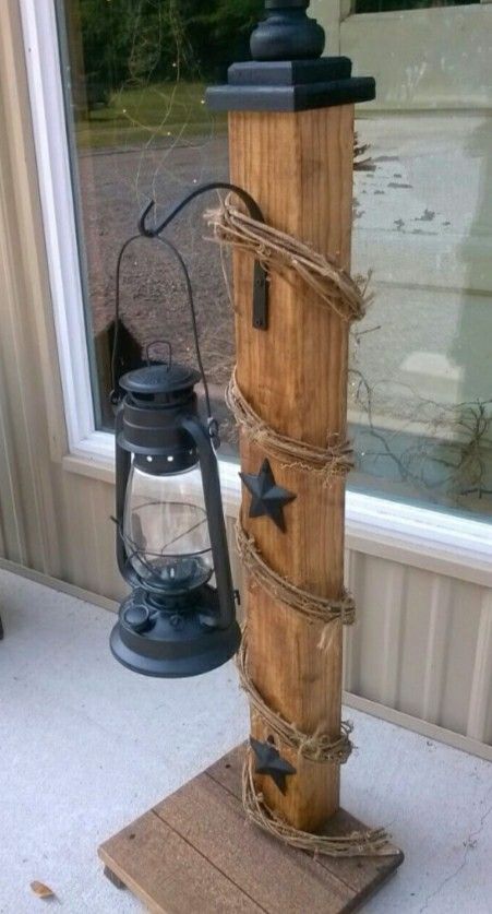 an old lantern is sitting on the porch