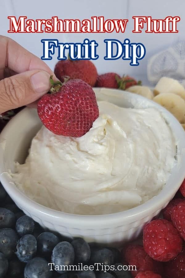 a person dipping fruit into a bowl with the words marshmallow fluff on it