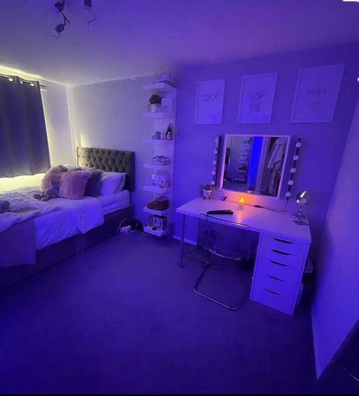 a bedroom with purple lighting in the corner and a bed, desk, mirror and dresser