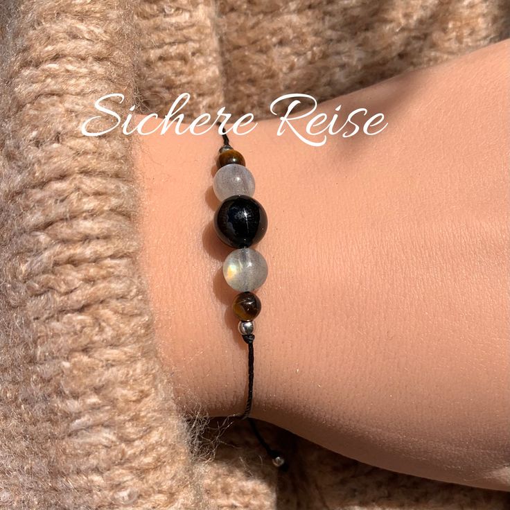 As a gift for your loved ones or for yourself, feel accompanied, protected and safe <3 The bracelet is made of macrame yarn with black tourmaline, tiger eye and labradorite natural stone beads (4 mm, 6 mm and 8 mm). The spacer beads (2.5 mm) are made of stainless steel or, in the case of gold-colored ones, 14k gold filled. It is adjusted with a knotted sliding clasp so that it fits almost every wrist. Your piece of jewelry will be delivered with a beautiful card with meanings and motivational qu Travel Bracelet, Macrame Yarn, Gemstones Crystals, Natural Stone Beads, Happy Travels, Jewellery Ideas, Safe Travel, Crystal Gifts, Black Tourmaline