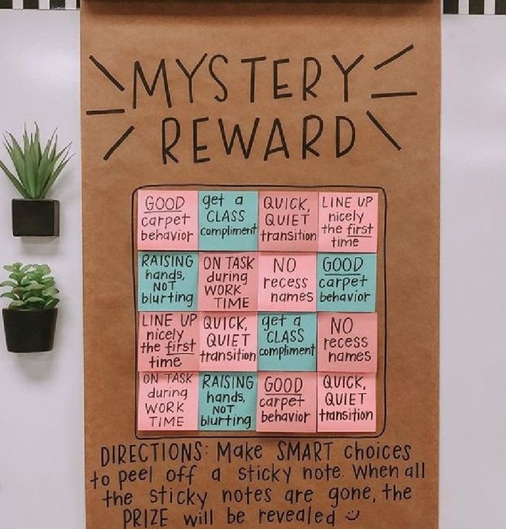 a brown paper bag with words written on it next to potted plants and a sign that says mystery reward