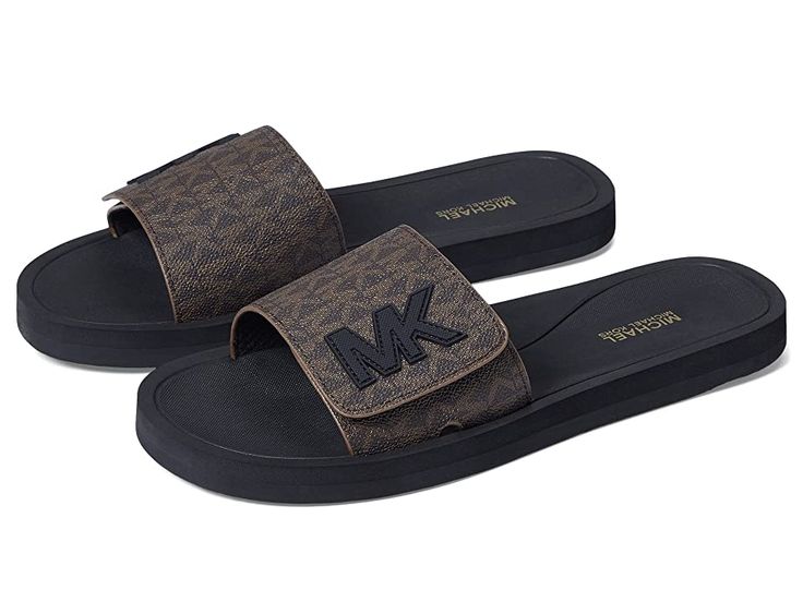 MICHAEL Michael Kors MK Slide - Women's Sandals : Brown 2 : Functionality and modern style come together in the MICHAEL Michael Kors MK Slide. Synthetic upper. Slide-on design. Open-toe silhouette. Signature logo detailing. Textile lining. Synthetic footbed. Synthetic sole. Imported. Measurements: Weight: 5 oz Product measurements were taken using size 9, width M. Please note that measurements may vary by size. Mk Slippers, Michael Kors Slides Brown, Mk Slides, Mk Sandals, Michael Kors Slides, Mk Shoes, Sam Edelman Sandals, Michael Kors Sandals, Slides Women