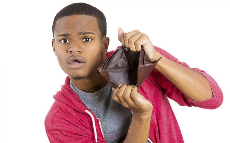 a young man is holding an origami piece