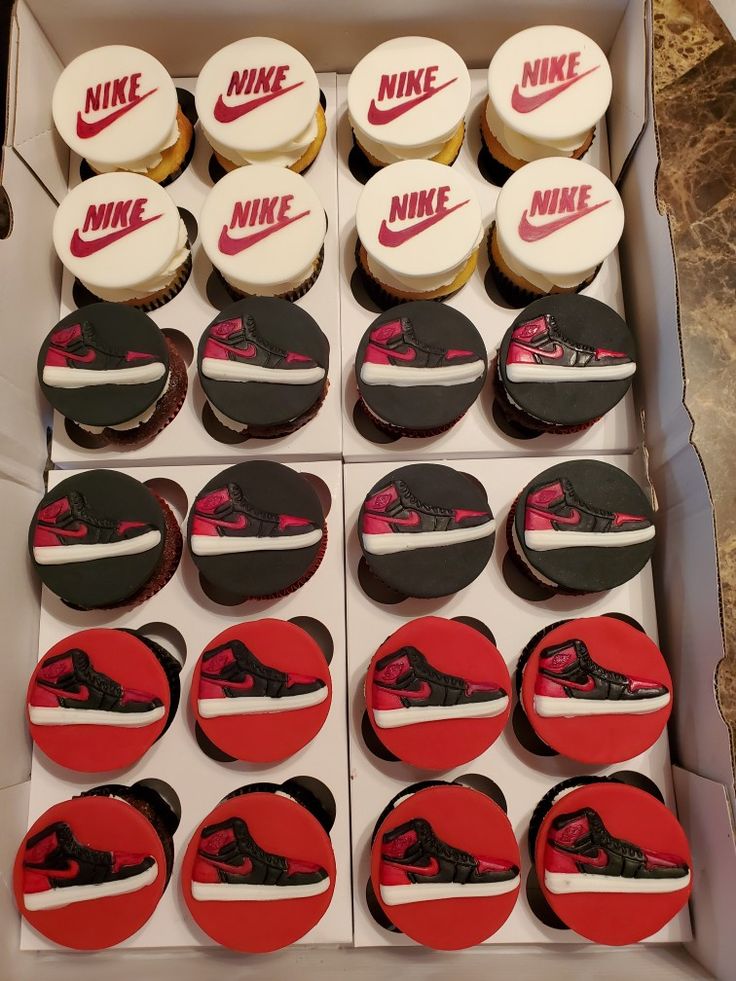 the cupcakes are decorated with nike logos